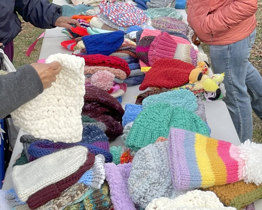 Participants selected from numerous colorful hats at the end of our 2024 hat drive.
